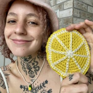Crochet purse made with Allo Baby in mustard yellow by Anna's Tits n' Tats