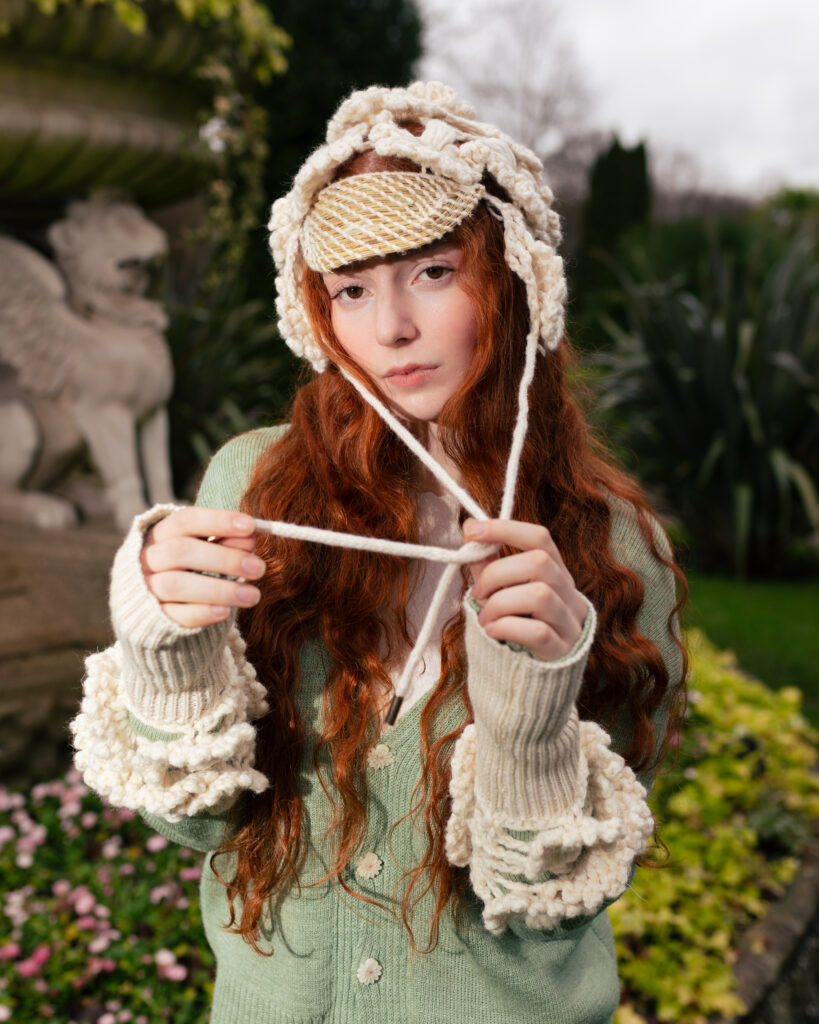 Crochet headpiece and knitted hand warmers by Acien with Wovenbeyond yarns.
