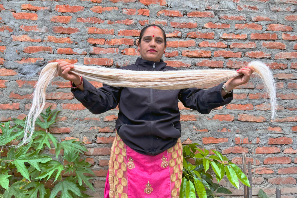 Woman holding Himalayan nettle fibre